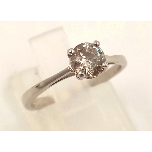 869 - A Platinum Solitaire Diamond Ring. 0.5ct. L- I1. Size J.
2.42g