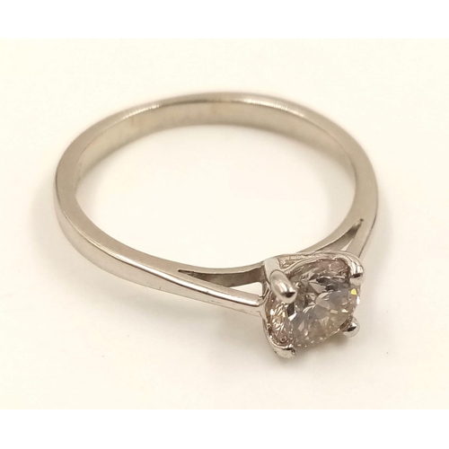 869 - A Platinum Solitaire Diamond Ring. 0.5ct. L- I1. Size J.
2.42g