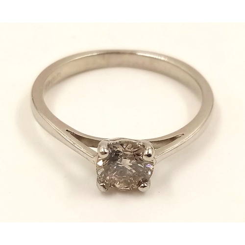 869 - A Platinum Solitaire Diamond Ring. 0.5ct. L- I1. Size J.
2.42g