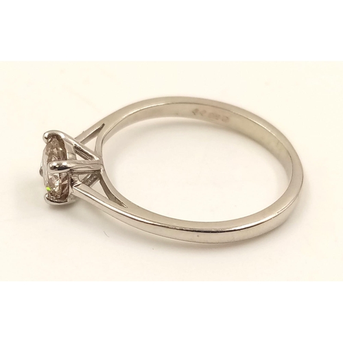 869 - A Platinum Solitaire Diamond Ring. 0.5ct. L- I1. Size J.
2.42g