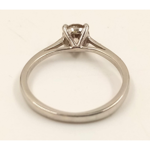 869 - A Platinum Solitaire Diamond Ring. 0.5ct. L- I1. Size J.
2.42g