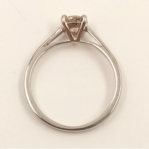 869 - A Platinum Solitaire Diamond Ring. 0.5ct. L- I1. Size J.
2.42g