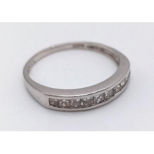 764 - A Platinum Diamond Half-Eternity Ring. 0.30ct.
Size O. 3.1g