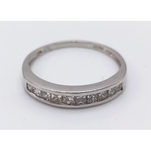 764 - A Platinum Diamond Half-Eternity Ring. 0.30ct.
Size O. 3.1g