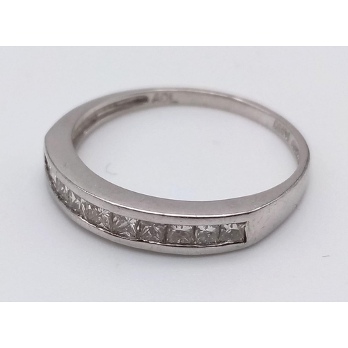 764 - A Platinum Diamond Half-Eternity Ring. 0.30ct.
Size O. 3.1g