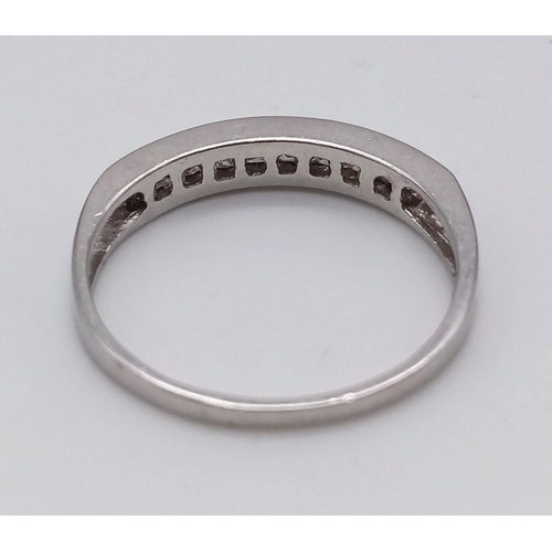 764 - A Platinum Diamond Half-Eternity Ring. 0.30ct.
Size O. 3.1g