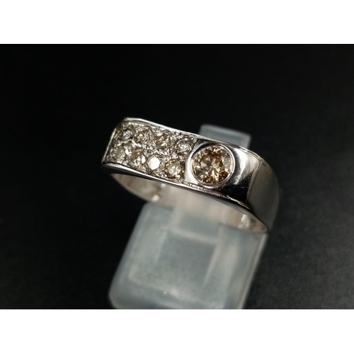 617 - A 14k White Gold Champagne Diamond Ring.
0.50ct. Size P. 2.6g