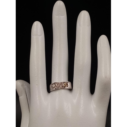 617 - A 14k White Gold Champagne Diamond Ring.
0.50ct. Size P. 2.6g