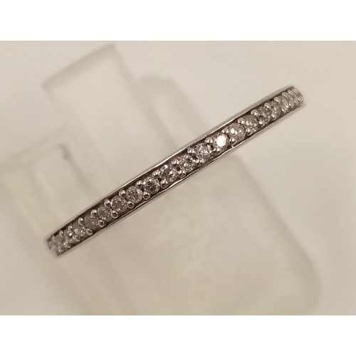 848 - A 14K White Gold Diamond Half-Eternity Ring. Size O.
1.45g