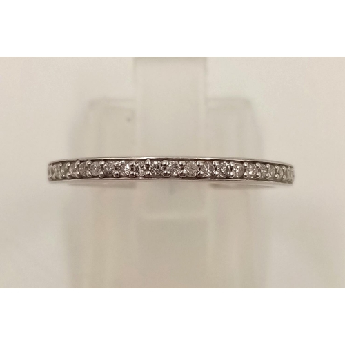 848 - A 14K White Gold Diamond Half-Eternity Ring. Size O.
1.45g