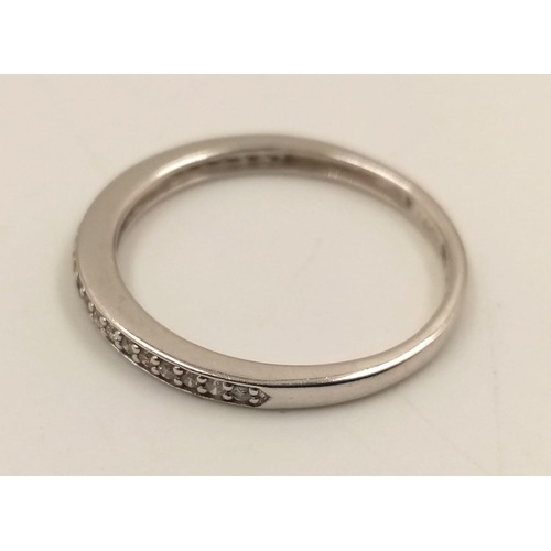 848 - A 14K White Gold Diamond Half-Eternity Ring. Size O.
1.45g