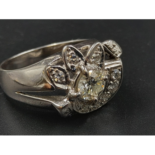 576 - A 14K White Gold Abstract Floral Diamond Ring - Centre pistil diamond with petals and half-moon diam... 