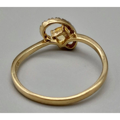 1045 - A 9K Yellow Gold Ring with Centre Yellow Stone and surrounded by wave of Diamond. Size U/T
Total wei... 