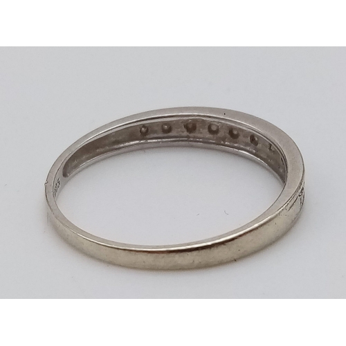 953 - A 9K White Gold Diamond Half Eternity Ring. Size O
Total weight: 1.46g