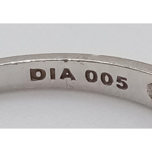 953 - A 9K White Gold Diamond Half Eternity Ring. Size O
Total weight: 1.46g