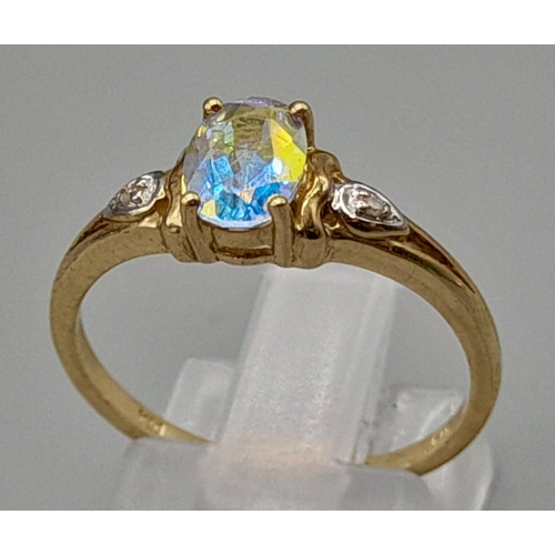 1059 - A 9K Yellow Gold ring with Centre Iridescent Stone with Diamonds on both sides. Size O/P. 
Total wei... 