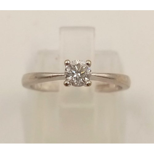 645 - A 9k White Gold Diamond Solitaire Ring. 0.20ct.
Size J. 1.90g