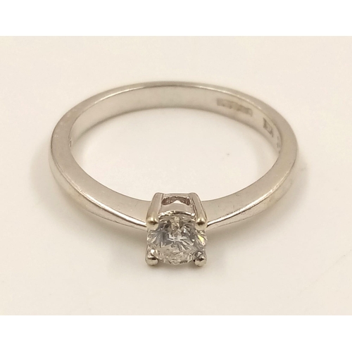 645 - A 9k White Gold Diamond Solitaire Ring. 0.20ct.
Size J. 1.90g