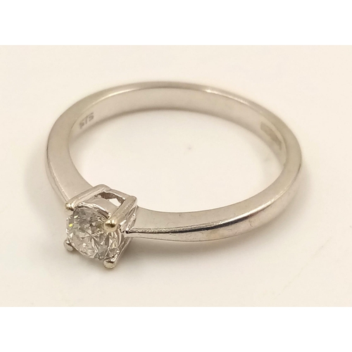 645 - A 9k White Gold Diamond Solitaire Ring. 0.20ct.
Size J. 1.90g