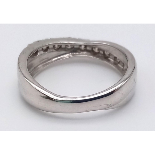 1252 - A 9K White Gold Twist Half-Eternity Diamond Ring. 0.60ct. Size N. 3.77g