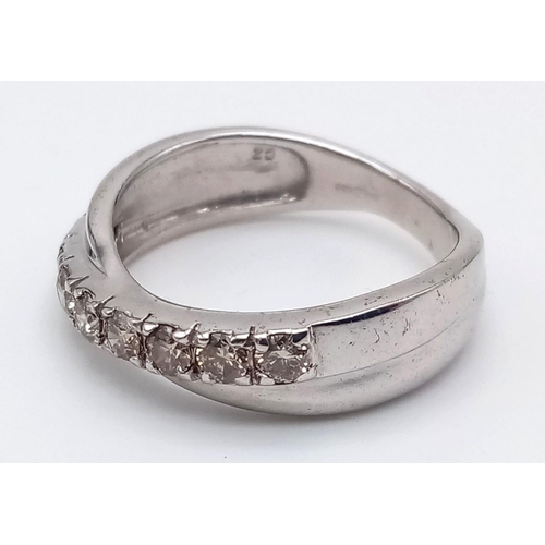 1252 - A 9K White Gold Twist Half-Eternity Diamond Ring. 0.60ct. Size N. 3.77g