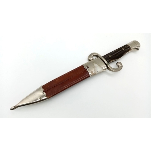 654 - A Vintage Toledo Dagger with Scabbard. In good condition but please see photos. 33cm total length.