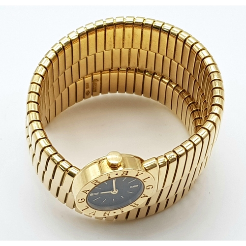 296 - A Bulgari 18k Yellow Gold Serpent Tubogas Ladies Watch. Black dial. Gold case - 18mm. Quartz movemen... 