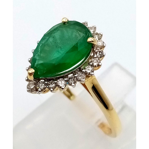 39 - A 14K Yellow Gold 2.10ct Zambian Emerald with Diamond Surround (0.40ct) Ring. Size N/O. 2.9g total w... 