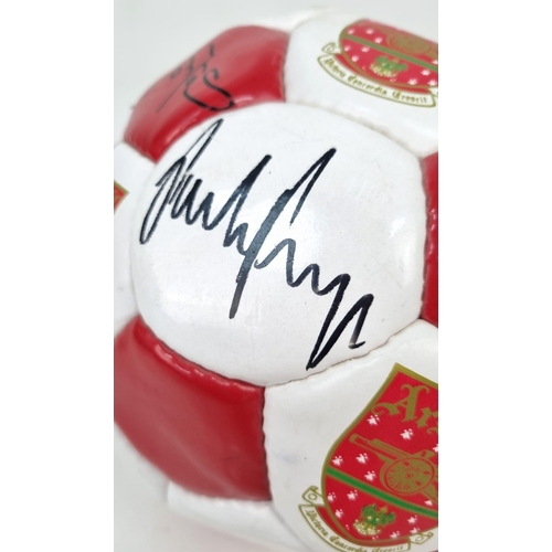 396 - An Arsenal FC 1999-2000 Signed Football. Signatures include Bergkamp, Adams, Keown, Dixon and Silvin... 