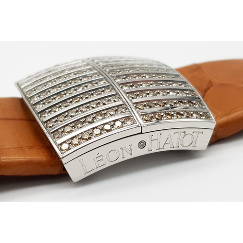 643 - A Leon Hatot Peek a Boo Diamond Ladies Watch. Brown leather strap. Diamond filled front case with pe... 