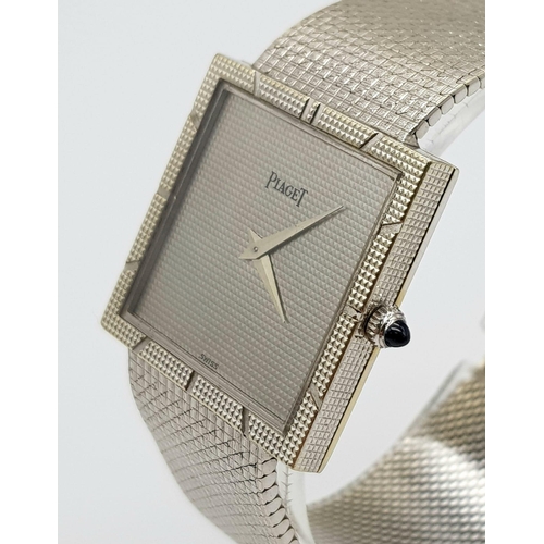 733 - A Piaget 18K White Gold Ladies Watch. 18k gold strap and square case - 26 x 26mm. Silver tone geomet... 