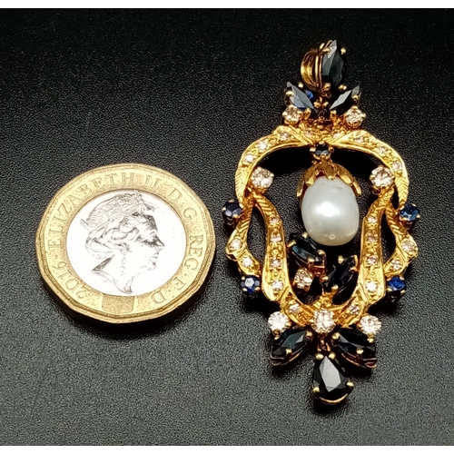 1227 - AN EDWARDIAN 18K GOLD DIAMOND AND SAPPHIRE PENDANT WITH A SOUTH SEA PEARL AT CENTRE.  11.1gms  5cms ... 