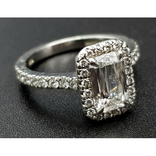 689 - A Boodles Vintage Ashoka-Cut Diamond in Platinum Ring. 1.2ct central diamond with an additional 0.45... 