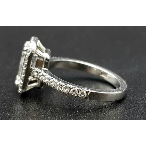 689 - A Boodles Vintage Ashoka-Cut Diamond in Platinum Ring. 1.2ct central diamond with an additional 0.45... 