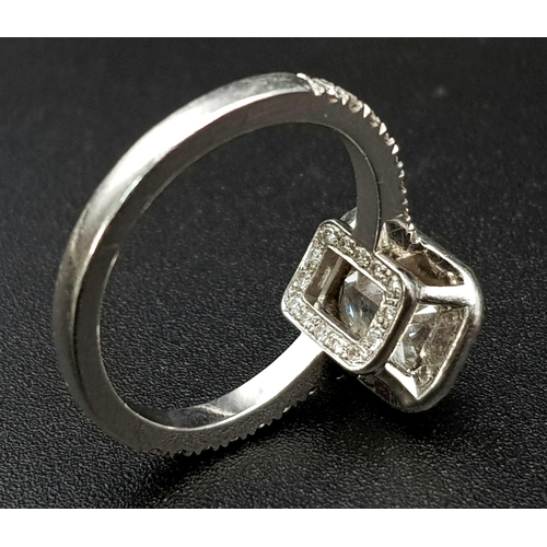 689 - A Boodles Vintage Ashoka-Cut Diamond in Platinum Ring. 1.2ct central diamond with an additional 0.45... 