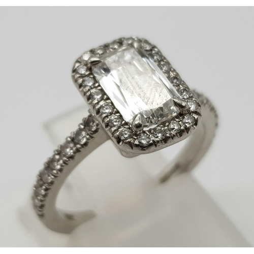 689 - A Boodles Vintage Ashoka-Cut Diamond in Platinum Ring. 1.2ct central diamond with an additional 0.45... 