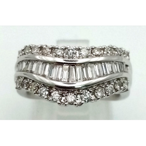 1393 - An 18K white gold ring with wavy band of baguette cut diamonds, accompanied by further two bands of ... 