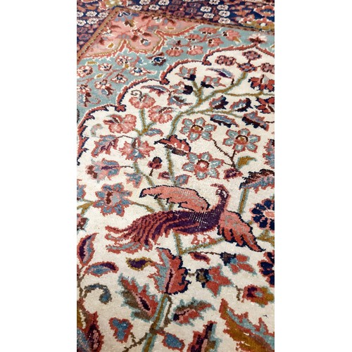 1203 - Three hand woven rugs, one silk and an antique hand woven tapestry/wall hanging. The silk rug is in ... 