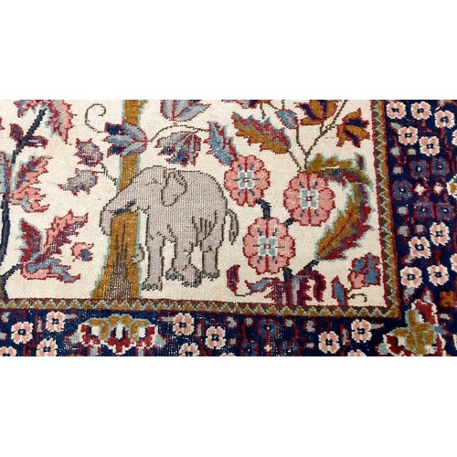 1203 - Three hand woven rugs, one silk and an antique hand woven tapestry/wall hanging. The silk rug is in ... 