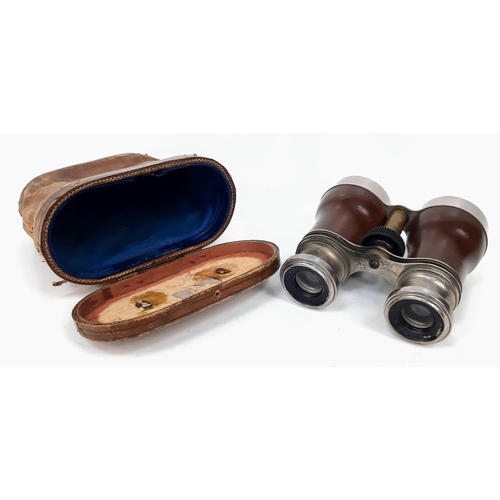 1547 - Two Pairs of Vintage Binoculars. One in original case. A/F