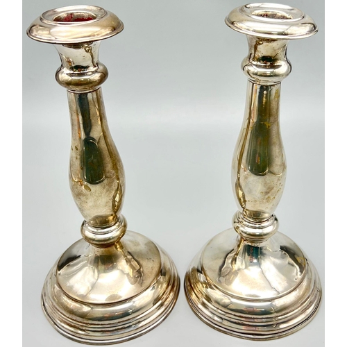 1209 - Two Antique Silver Candlesticks. 349g total weight.
23cm tall.