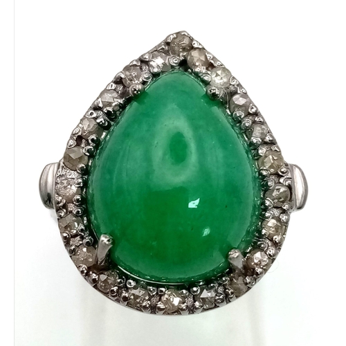 1544 - A 6.80ct Natural Emerald Cabochon Ring set in 925 silver and decorated with a 0.28ct Diamond accent ... 