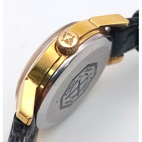 1341 - A ladies Zodiac watch with black leather strap.