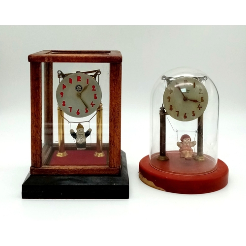 1088 - Two Wonderful Vintage possibly Antique Girl on Swing Glass- Cased mantle Clocks. Both are in working... 