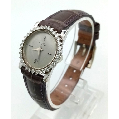 1248 - A Vintage Jaeger 18K Gold Ladies Watch. Grey leather strap. Gold case - 25mm. Diamond bezel. Quartz ... 