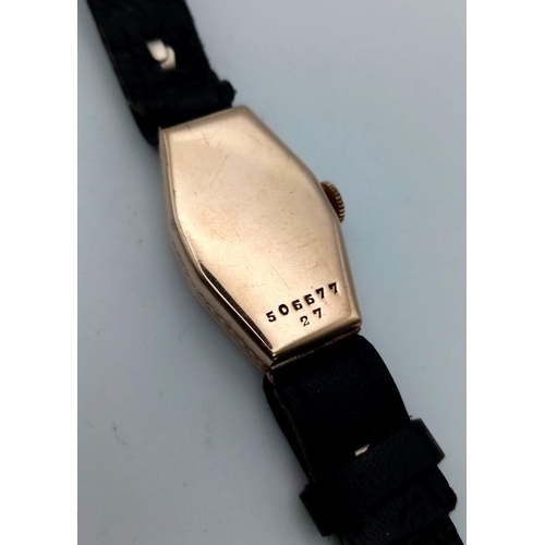 1359 - A Vintage Rolex 18k Gold Cased Ladies Watch. Black leather strap. Gold case - 16 x 27mm. Mechanical ... 