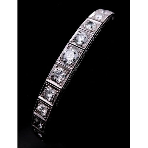 15 - A Time-Stopping Graduated 6ct (approx) Diamond and Platinum Ladies Bracelet. 32 brilliant round cut ... 