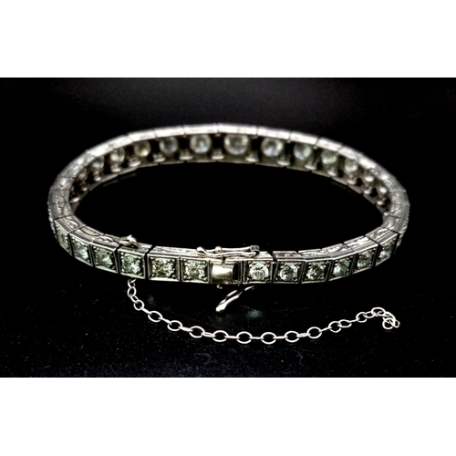 15 - A Time-Stopping Graduated 6ct (approx) Diamond and Platinum Ladies Bracelet. 32 brilliant round cut ... 