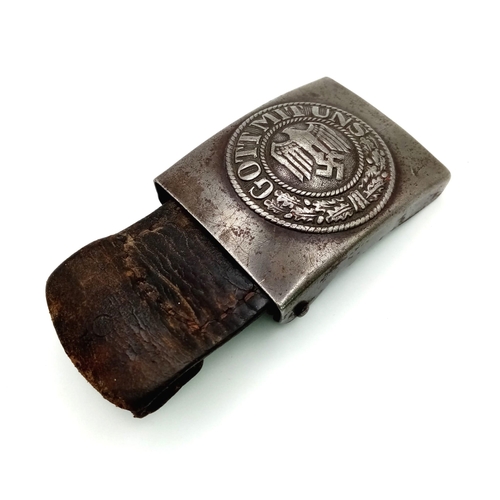 432 - A WW2 German Steel Army Buckle. With original leather tab circa 1941.