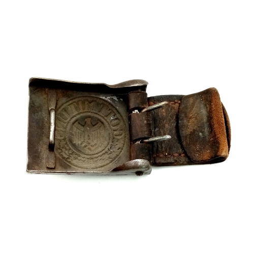 432 - A WW2 German Steel Army Buckle. With original leather tab circa 1941.